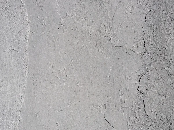 The old plastered background on a building wall with cracks — Stock Photo, Image
