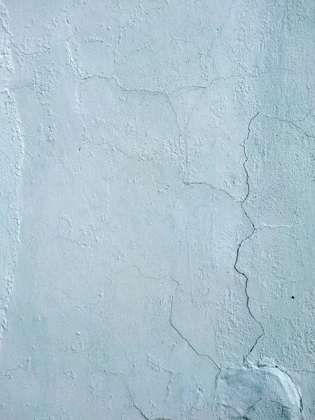 The old plastered background on a building wall with cracks — Stock Photo, Image