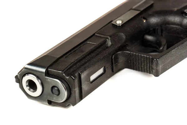 Det svarta vapnet (pistol) på en vit bakgrund på nära håll. — Stockfoto