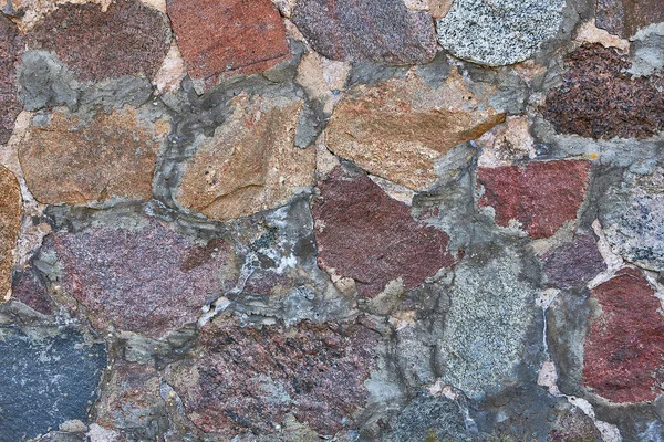 Doğal taştan yapılmış arka plan taşları. Çimento ve kaldırım taşları.