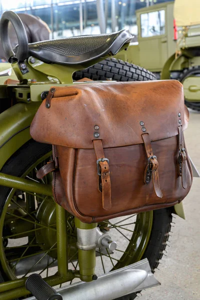 An old leather Luggage bag for a military motorcycle.