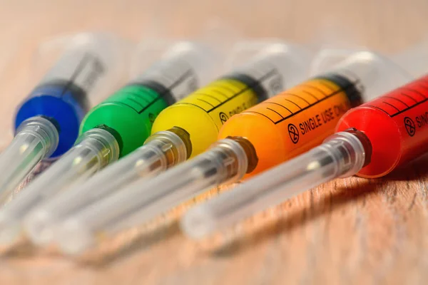 Concept Photo Covid Virus Vaccine Search Syringes Different Color Filling — Stock Photo, Image