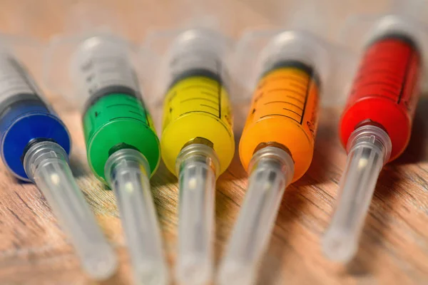Concept Photo Covid Virus Vaccine Search Syringes Different Color Filling — Stock Photo, Image