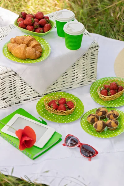 Summer time: picnic on the grass - coffee and croissants, juice