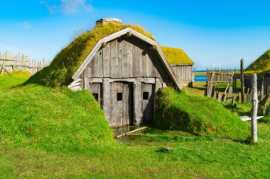 Traditional antique Viking village. Old wooden houses near Vestrahorn mountains on the Stokksnes Peninsula, Hofn, Iceland. Popular tourist attraction clipart