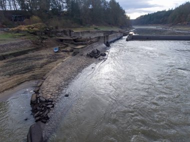 The first mention of it is from 1718. In 1929 in its place completed power plant brewery. Together with the construction of the power plant, the local weir was raised up to 2.8 meters and a 62-meter raft culvert was built at the left bank. The weir o