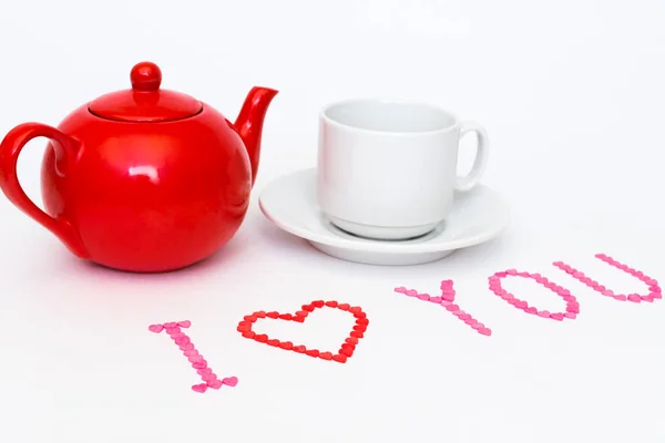 Piros teáskanna és teáscsésze pár ezekkel a szavakkal, "I love you" — Stock Fotó