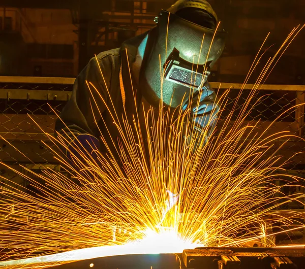 Welder, welding automotive part in a car factory — Stock Photo, Image