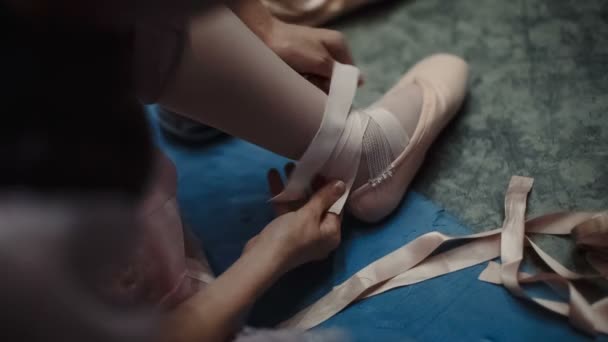 Ballerina wears Pointe shoes. POV — Stock video