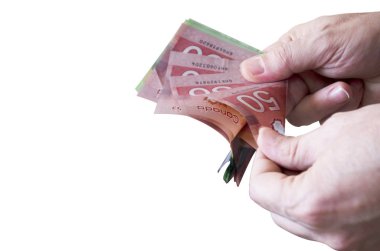 Man Counting Canadian Dollars clipart