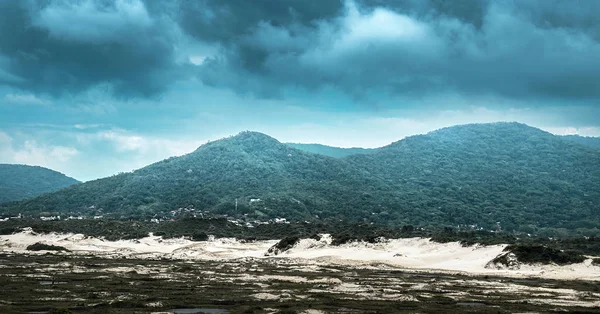 Storm forming around the mountains.