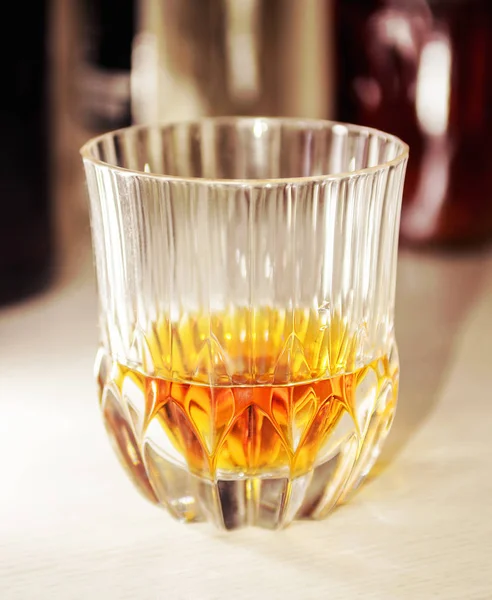 Crystal glass with a dose of pure whiskey Stock Image