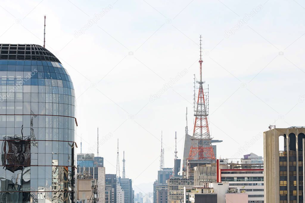 Communication antennas on top of tall buildings
