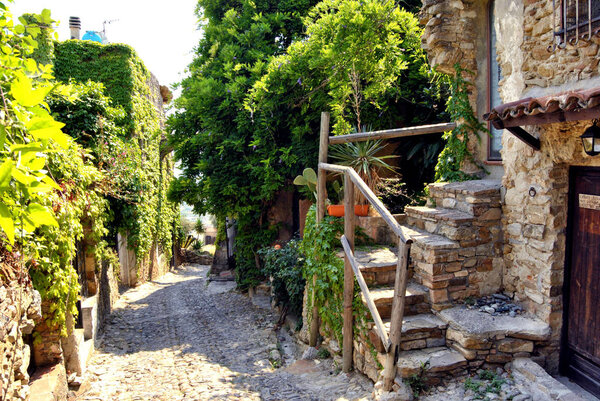 Historic alleys of Bussana Vecchia (Liguria, Italy), abandoned and renovated village of artists
