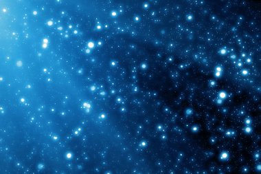 Sihirli Noel mavi arka plan. Bokeh veya parlak ışık karanlık zemin yok. Yuvarlak ufuk parçacıklar