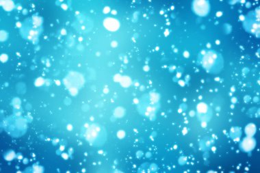 Noel soyut bokeh parlak ışıklar mavi zemin üzerine. Yuvarlak ufuk daire parçacıklar