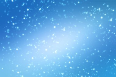 Noel soyut bokeh parlak ışıklar mavi zemin üzerine. Yuvarlak ufuk daire parçacıklar