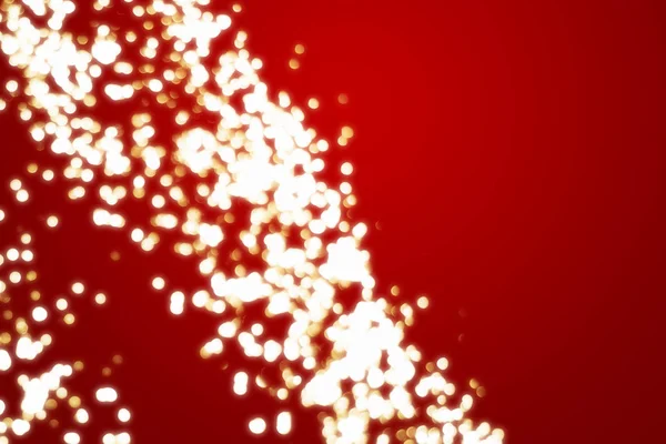 Xmas gouden achtergrond bokeh op rood — Stockfoto