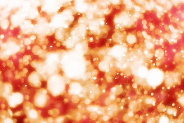 Röd jul bakgrund med gyllene glitter eller bokeh lampor. Runda oskärpa partiklar — Stockfoto