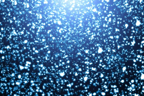 Fundo azul de Natal. Partículas de neve ou bokeh — Fotografia de Stock