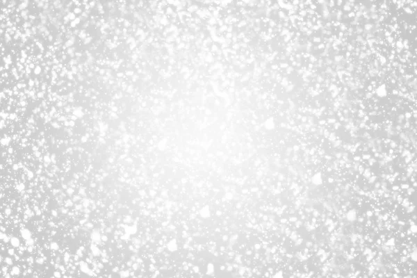 Snow flakes  bokeh or glitter lights festive silver  background. Christmas abstract template