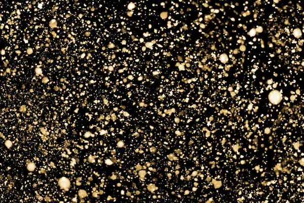Різдвяний сніг або золоті частинки або блискучі вогні ізольовані на чорному тлі - елемент дизайну — стокове фото
