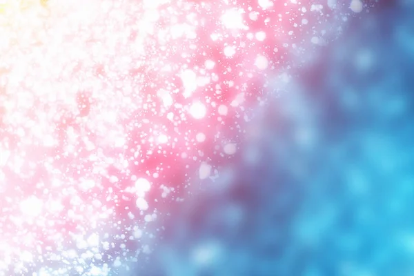 Abstrakta bokeh glitter julbelysning på blå bakgrund. Runda oskärpa cirkeln partiklar — Stockfoto