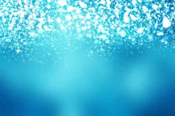 Noel soyut bokeh parlak ışıklar mavi zemin üzerine. Yuvarlak ufuk daire parçacıklar