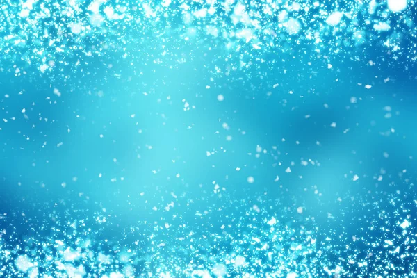 Christmas abstract bokeh glitter lights on blue background. Round defocused circle particles — Stock Photo, Image