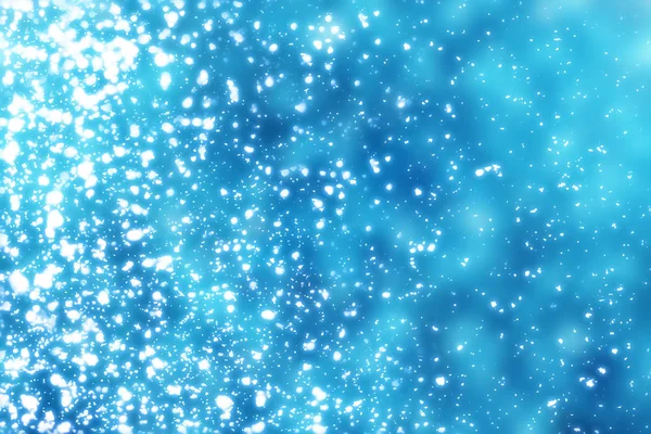 Weihnachten abstrakte Bokeh Glitzerlichter auf blauem Hintergrund. Runde defokussierte Kreis-Teilchen — Stockfoto