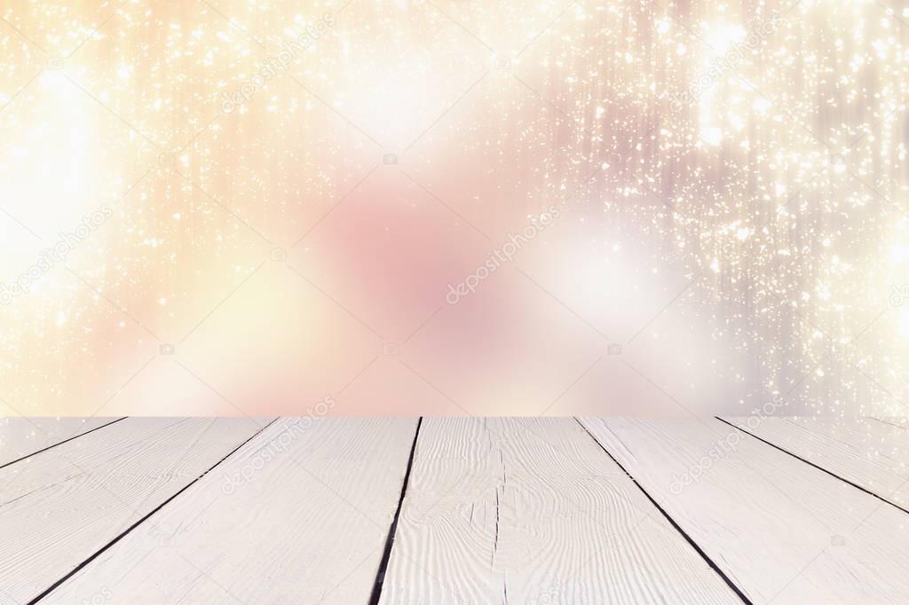 Golden glitter lights or bokeh and white table. Christmas background