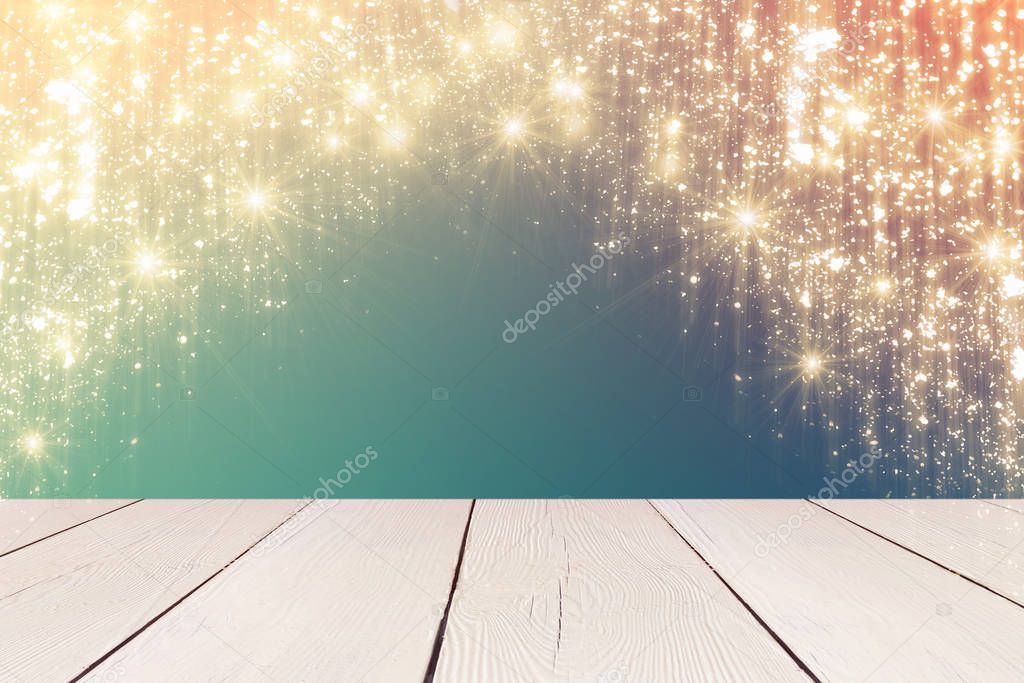 Dark Christmas background and glitter lights or bokeh. White table 