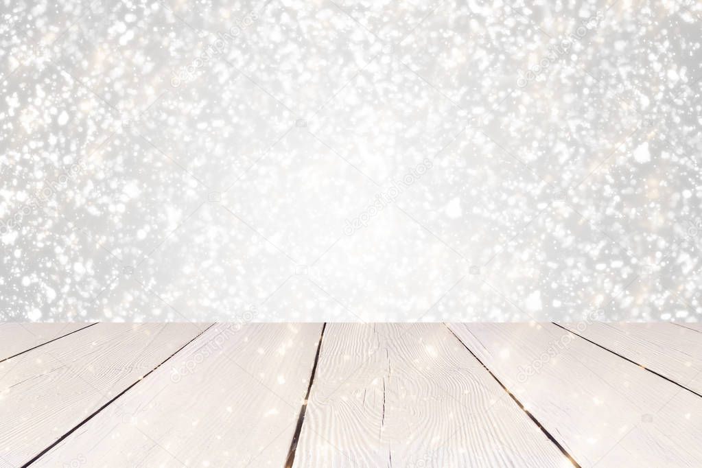 Christmas abstract Silver background with golden round bokeh or circle glitter lights and white table. Use  for display or montage your products
