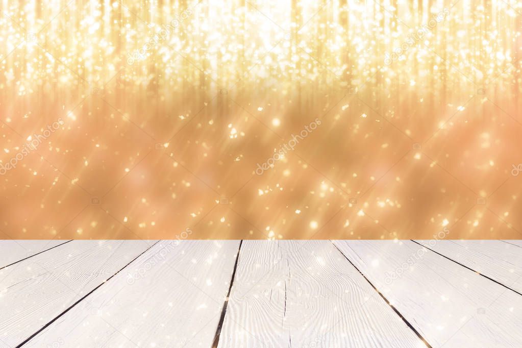 Christmas abstract background with golden round bokeh or circle glitter lights  and white table. Use  for display or montage your products
