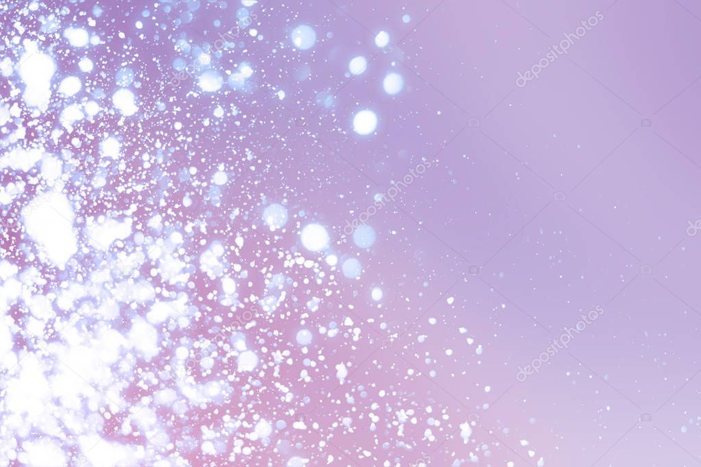 Christmas abstract bokeh glitter lights on serenity  background. Round defocused circle particles
