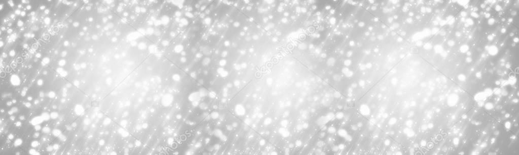 Silver Christmas Background with white circle glitter or bokeh lights. Panoramic view