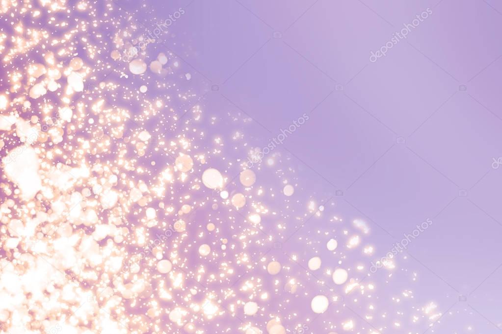 Christmas abstract bokeh glitter lights on serenity  background. Round defocused circle particles