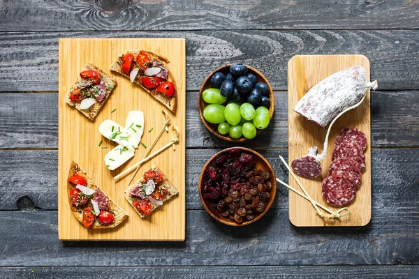 Italian bruschetta made with toasted slices of bread with cherry — Stock Photo, Image