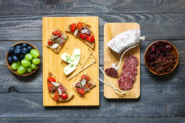 Italian bruschetta made with toasted slices of bread with cherry — Stock Photo, Image