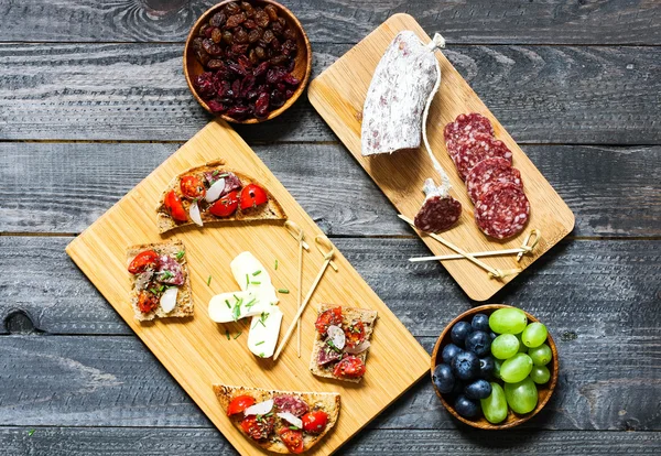 Italian bruschetta made with toasted slices of bread with cherry — Stock Photo, Image