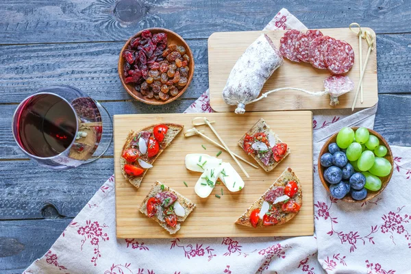 Italian bruschetta made with toasted slices of bread with cherry — Stock Photo, Image