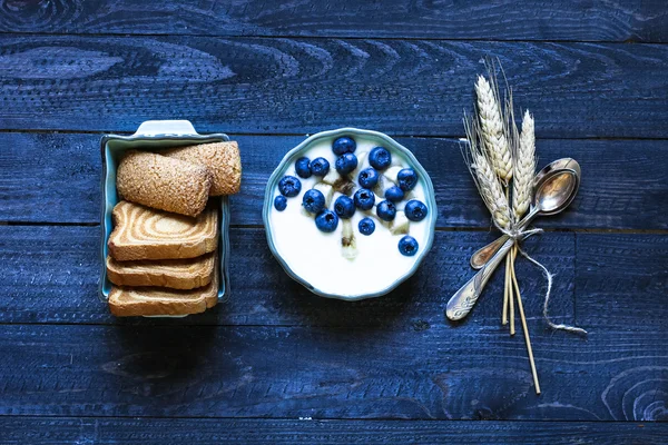 Healthy Breakfast with blueberries and banana yogurt