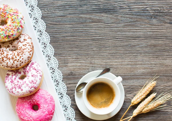Morning breakfast with colorful Donuts and coffee — Stock Photo, Image