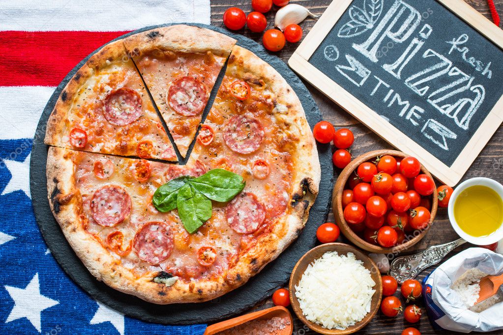 Hot Italian pizza on a rustic wooden table.