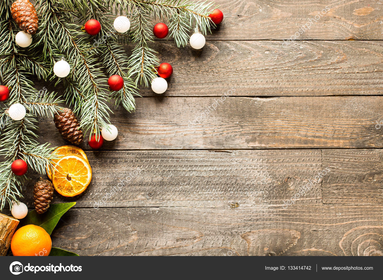 Christmas holiday background with ornaments on rustic