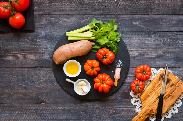 Different types of vegetables, on a old wooden table, space for — Stock Photo, Image