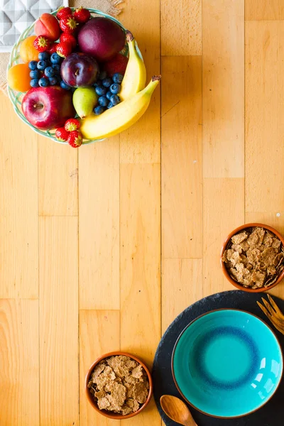 Bowl of fresh fruit with banana, apple, strawberries, apricots, — Stock Photo, Image