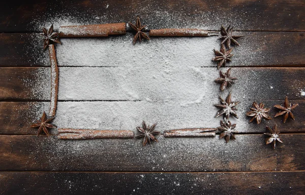 cinnamon stick frame stars star anise icing sugar for Christmas decor