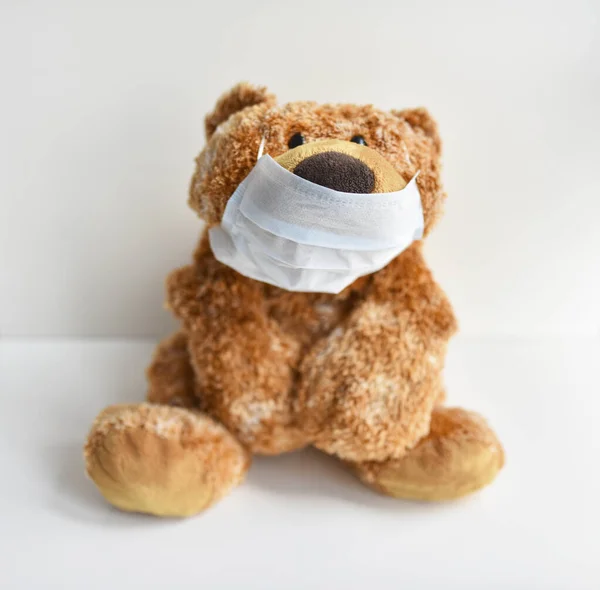 toy plush bear in a medical mask