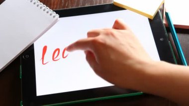 Liderlik. Tablet üzerine beyaz yazılı.